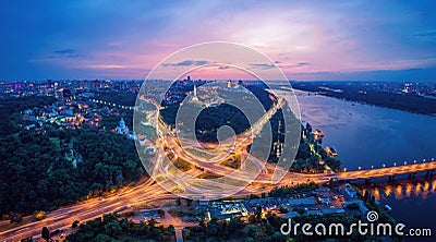 Night city panorama of the Kiev city with the Paton Bridge and the Dnieper River. Ukraine Stock Photo