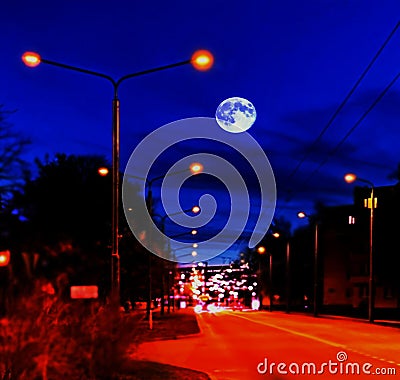 Night city sleeps ,lanterns on the road, cars lights blurry , blue sky and full moon with moonlight panorama Stock Photo