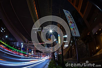 A night city street under the highway in Tokyo fish eye shot Editorial Stock Photo