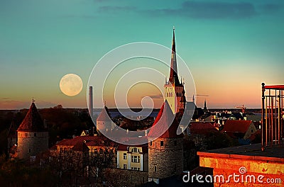 Night city Tallinn old town red roofs medieval panorama moon skyline clouds blue sky sun down summer weather Baltic sea on hor Stock Photo