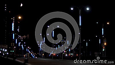 Night city traffic on street with the lonely moving car on black sky background. Stock footage. Beautiful late evening Stock Photo