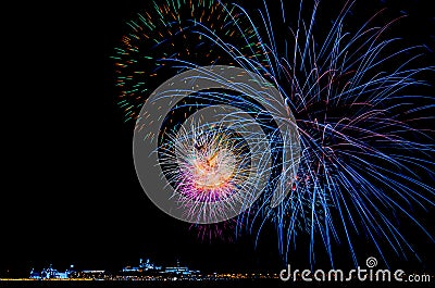 Night colorful fireworks in the sky over the city in Europe Stock Photo