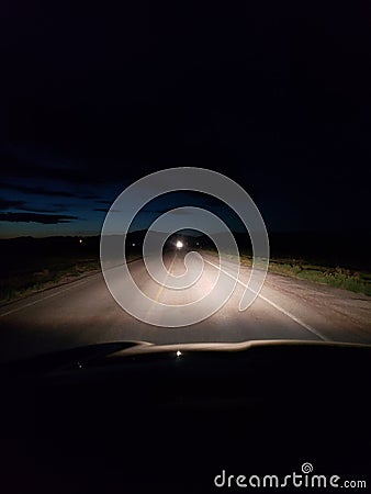 Night driving on a two lane rural road Stock Photo