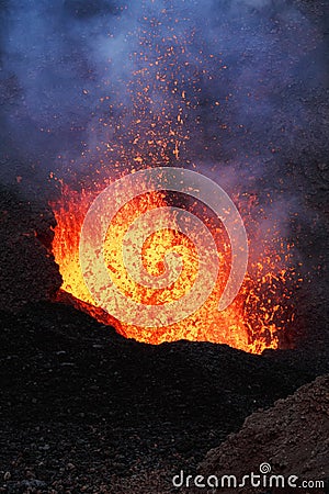 Night eruption volcano - lava lake, lava flowing in crater Stock Photo