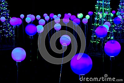 Night filled with colored balls of light - modern light show Stock Photo