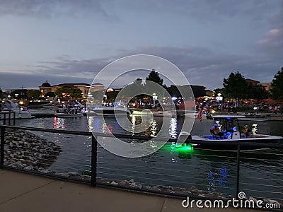 A night filled with lights reflecting the waters edge Stock Photo