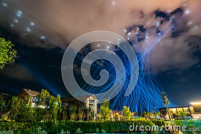 At night, huge light show from the ground to the sky is wonderful and magical Stock Photo