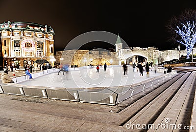 Night ice skating scene from Place d`Youville quebec Editorial Stock Photo