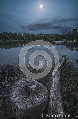 Night Landscape. Stump By the Lake. Stock Photo