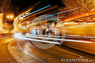 Night long exposure shot of two trams near the Mercado Central in Zaragoza, Spain Stock Photo