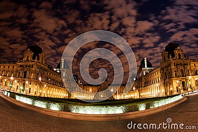 Night panoramic view of the Louvre Museum in Paris, France. Editorial Stock Photo