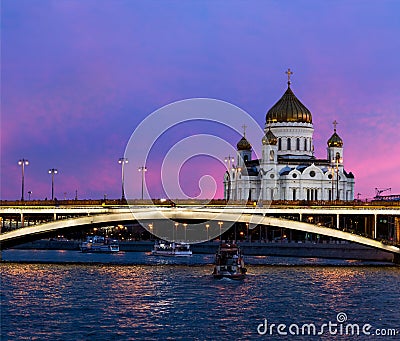 Night panoramic view of Moscow Christ the Savior Cathedral, Bolshoy Kamenny Bridge, Moskva river with pleasure boats and embankmen Editorial Stock Photo