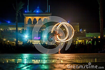 Night performance fire show in front of a crowd of people Editorial Stock Photo
