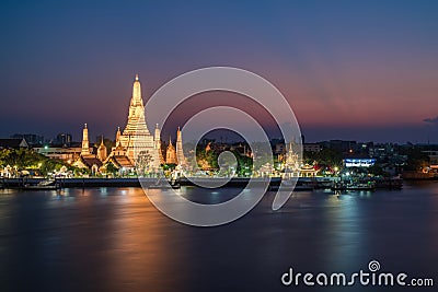 Night photo illuminated old Wat Arun Ratchawararam Ratchawaramahawihan or Wat Arun Editorial Stock Photo