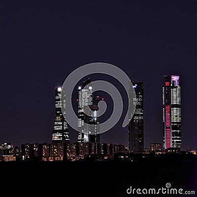 Night photography of the 4 towers of Madrid. Construction of the fifth tower Stock Photo