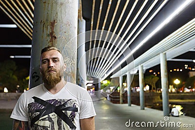 Night portrait of a street bearded man drug seller gang member bandit Stock Photo