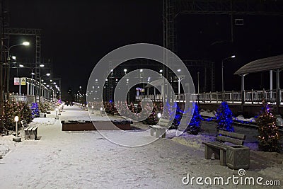 The night railway station is decorated with festoons for the new year Stock Photo