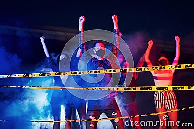 Night of riot. Group of protesting young people that standing together. Activist for human rights or against government Stock Photo