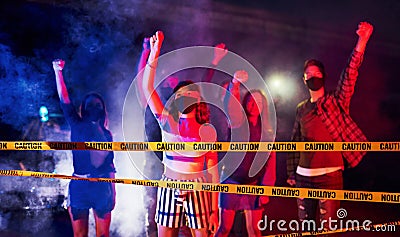 Night of riot. Group of protesting young people that standing together. Activist for human rights or against government Stock Photo