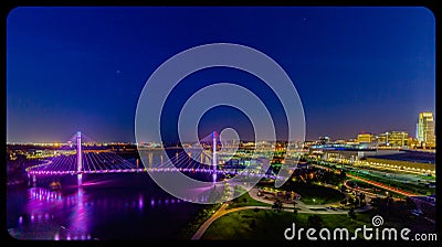 Night scene aerial view Bob Kerrey pedestrian bridge and downtown omaha Nebraska Stock Photo