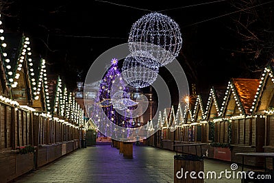 Night scene - empty Christmas marketplace with decorated small kiosk Stock Photo