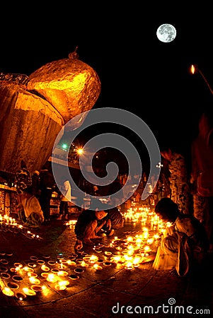 Night scene Kyaikhtiyo Pagoda in full Moon night. Editorial Stock Photo