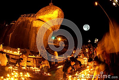 Night scene Kyaikhtiyo Pagoda in full Moon night. Editorial Stock Photo