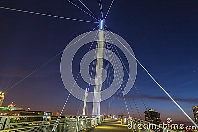 Night scene of Omaha Kerrey suspension bridge tower with suspension cables with beautiful sky colors just after sunset Stock Photo