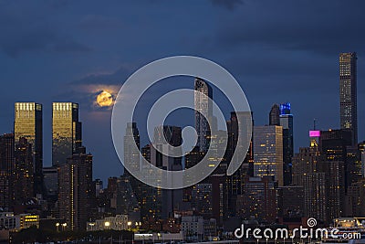Night Scene: Super Full Moon and City Lights Stock Photo