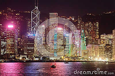 Night scenery of Hong Kong with a majestic skyline of crowded skyscrapers by Victoria Harbour Stock Photo