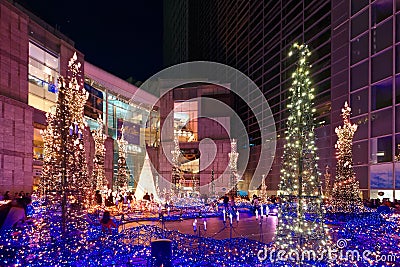 Night scenery of romantic Winter Illumination Display with decorated Christmas trees and dazzling lights Editorial Stock Photo
