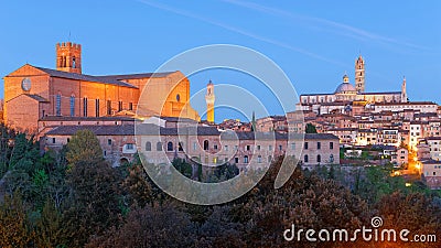 Night scenery of Siena, a medieval town in Tuscany Italy, with view of the Dome & Bell Tower of Siena Cathedral Duomo di Siena Stock Photo