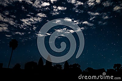 Night landscape with clouds, stars and Angkor Wat temple silhuette Stock Photo