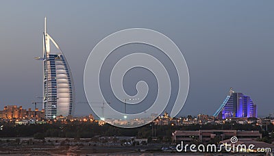 A night shot of Dubai's most well known landmarks : The Burj Al Arab and Jumeraih Beach Hotel. Editorial Stock Photo