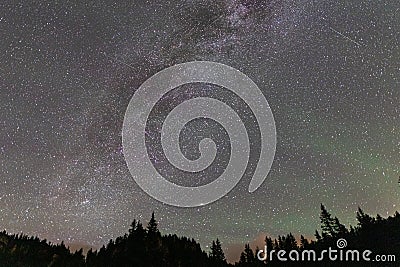 Milky way in the Dolomites forest with a amazing airglow in summer Stock Photo