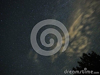 Night sky stars Auriga constellation and clouds Stock Photo