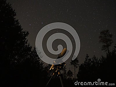 Night sky stars observing over telescope sky watcher 120/600 Stock Photo