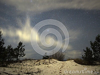 Night sky Lyra constellation stars clouds and snow observing winter landscape Stock Photo