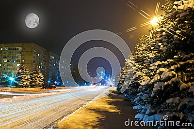 Night snowy road in the small town Stock Photo