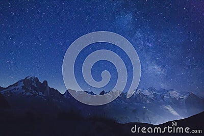 Night stars and milky way over alpine mountains Stock Photo