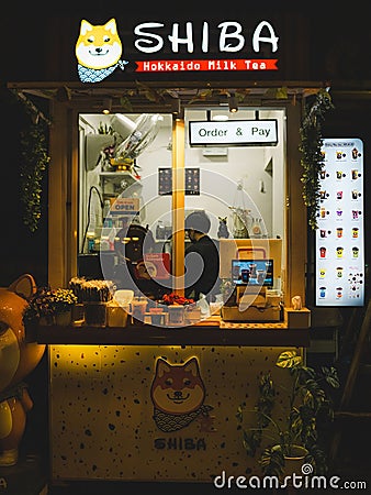 Night street food market in Bangkok, Thailand bustling with shoppers and vendors Editorial Stock Photo