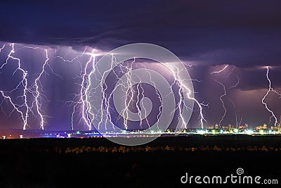 Night thunder lightning over the city sky Stock Photo