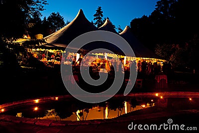 Night time wedding tent with a pool reflection Stock Photo
