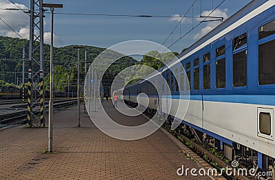 Night train with sleeping coaches and car motorcycle coaches Kysak station Stock Photo