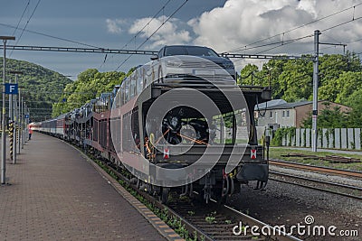 Night train with sleeping coaches and car motorcycle coaches Kysak station Stock Photo