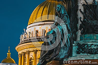 Night view of the ancient statues of stucco and the dome of St. Isaac`s Cathedral Saint-Petersburg. Stock Photo