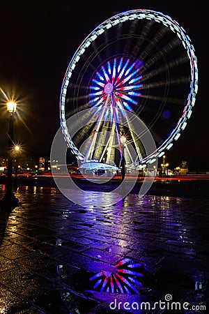 Night view of big wheel in Paris Editorial Stock Photo