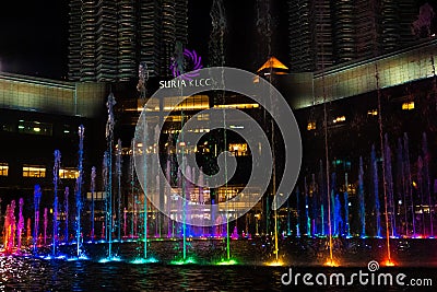 Night view of the dancing multi-colored fountains. Show of Singing Fountains Editorial Stock Photo