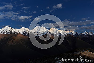 Night view of Gongga Shan or Minya Konka Mountain with Cloudy Sky and Stars, Sichuan Provence, China Stock Photo