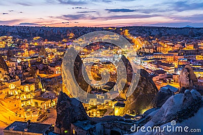 Night view of Goreme town with cave hotel built in rock formation in national park Goreme, Cappadocia, Turkey Editorial Stock Photo